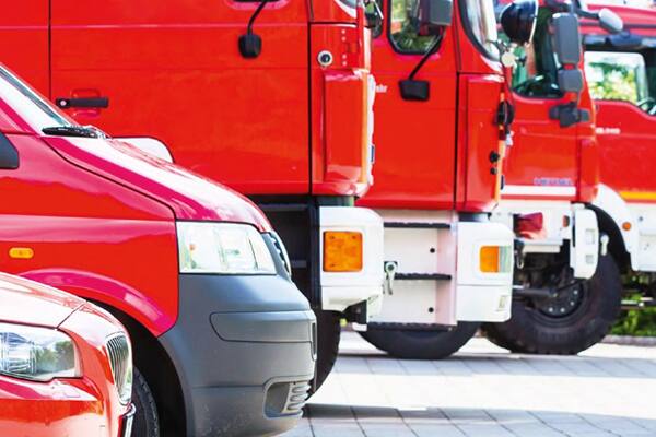 Group of fire trucks parked in a parallel line