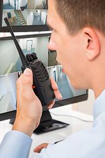 Security personnel inspecting cctv footage