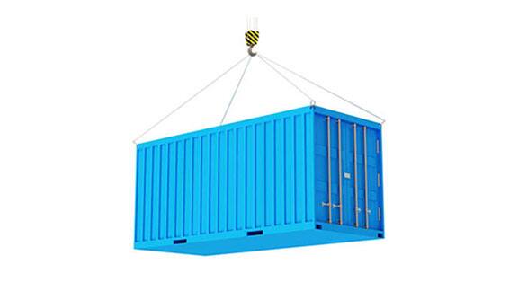 A crane uplifting a cargo container