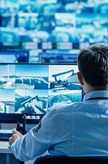 Two officers monitoring cctv footage