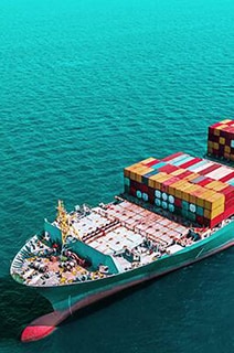 A loaded cargo ship in the ocean