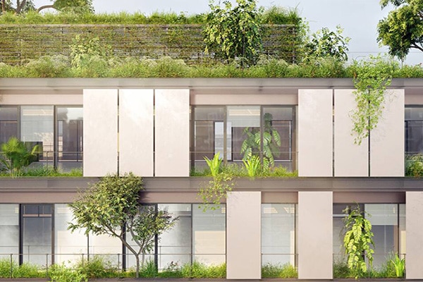 Facade of a modern residential building with green plants potted across open balconies